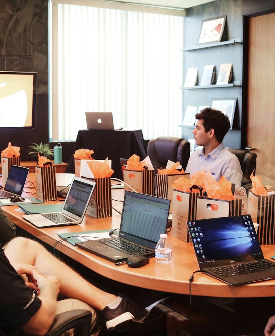 A business team meeting around a conference table
