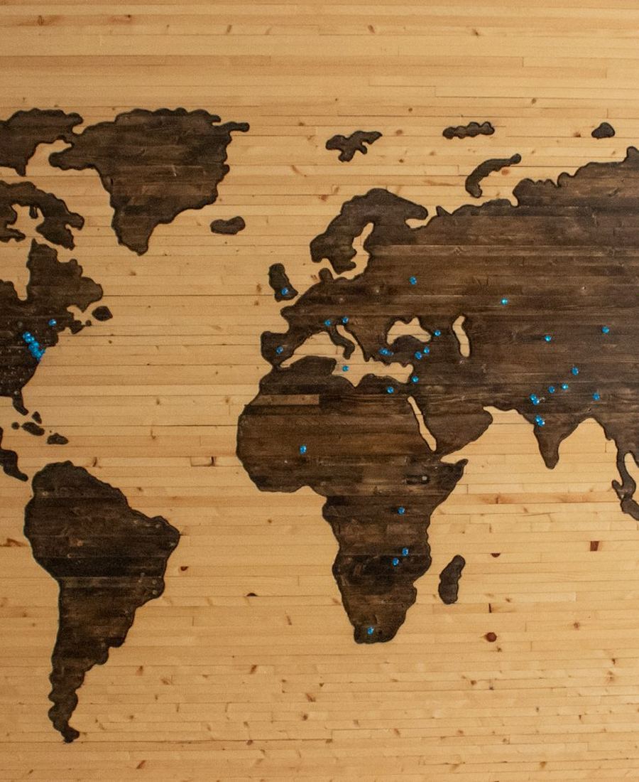 A world map carved into wood