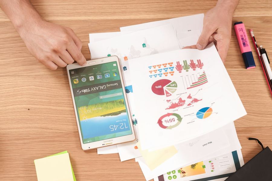 Planning worksheets and charts spread across a desk